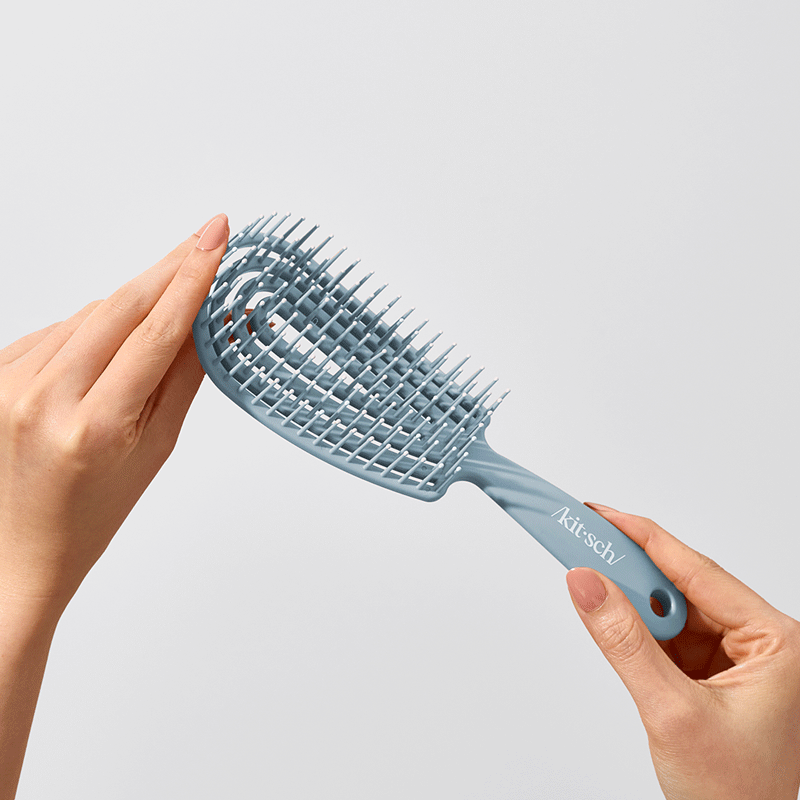 Cepillo desenredante flexible azul bruma