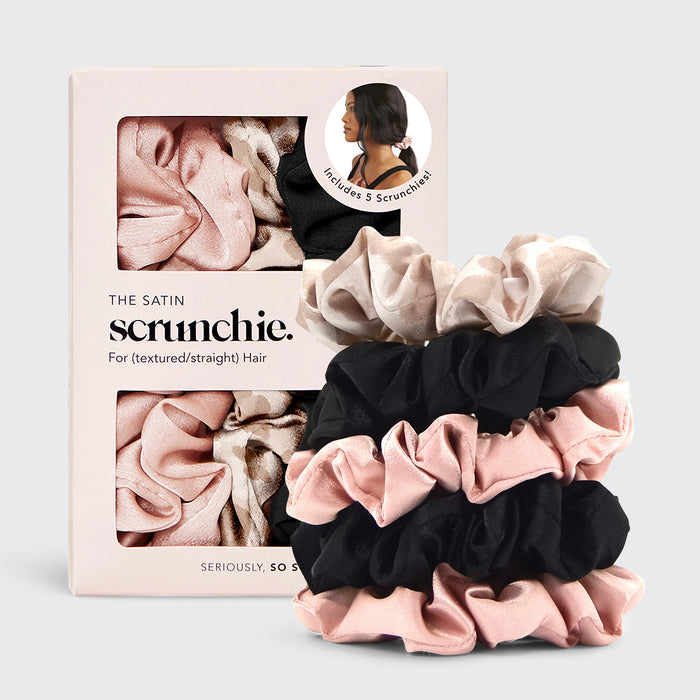 Set of satin scrunchies with packaging on a light gray background