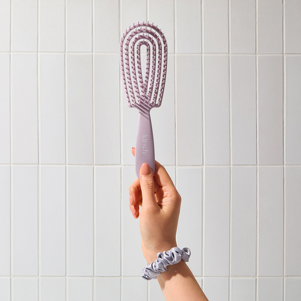 Cepillo desenredante flexible violeta suave