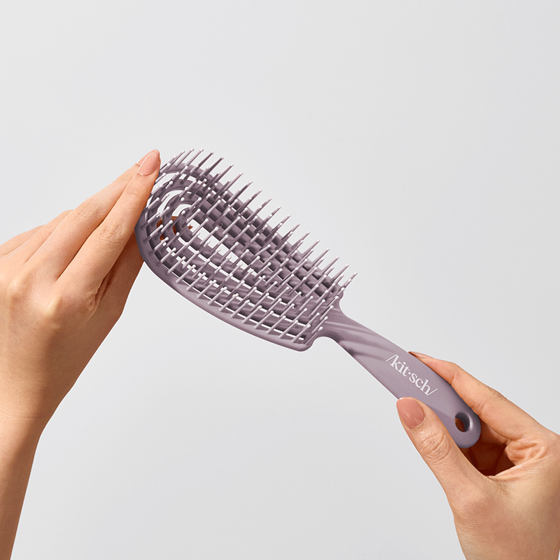 Cepillo desenredante flexible violeta suave