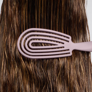 Cepillo desenredante flexible violeta suave