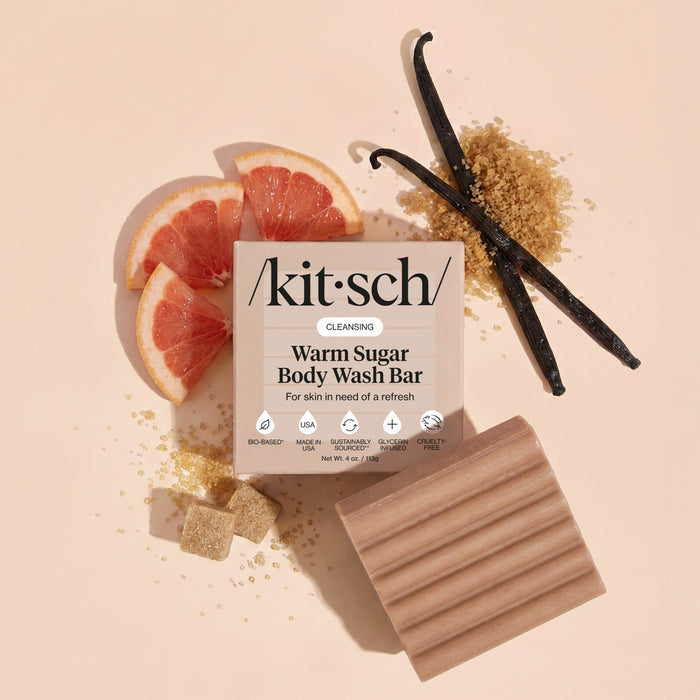 Kitsch Warm Sugar Body Wash Bar with pink grapefruit, vanilla beans, and brown sugar on a beige background