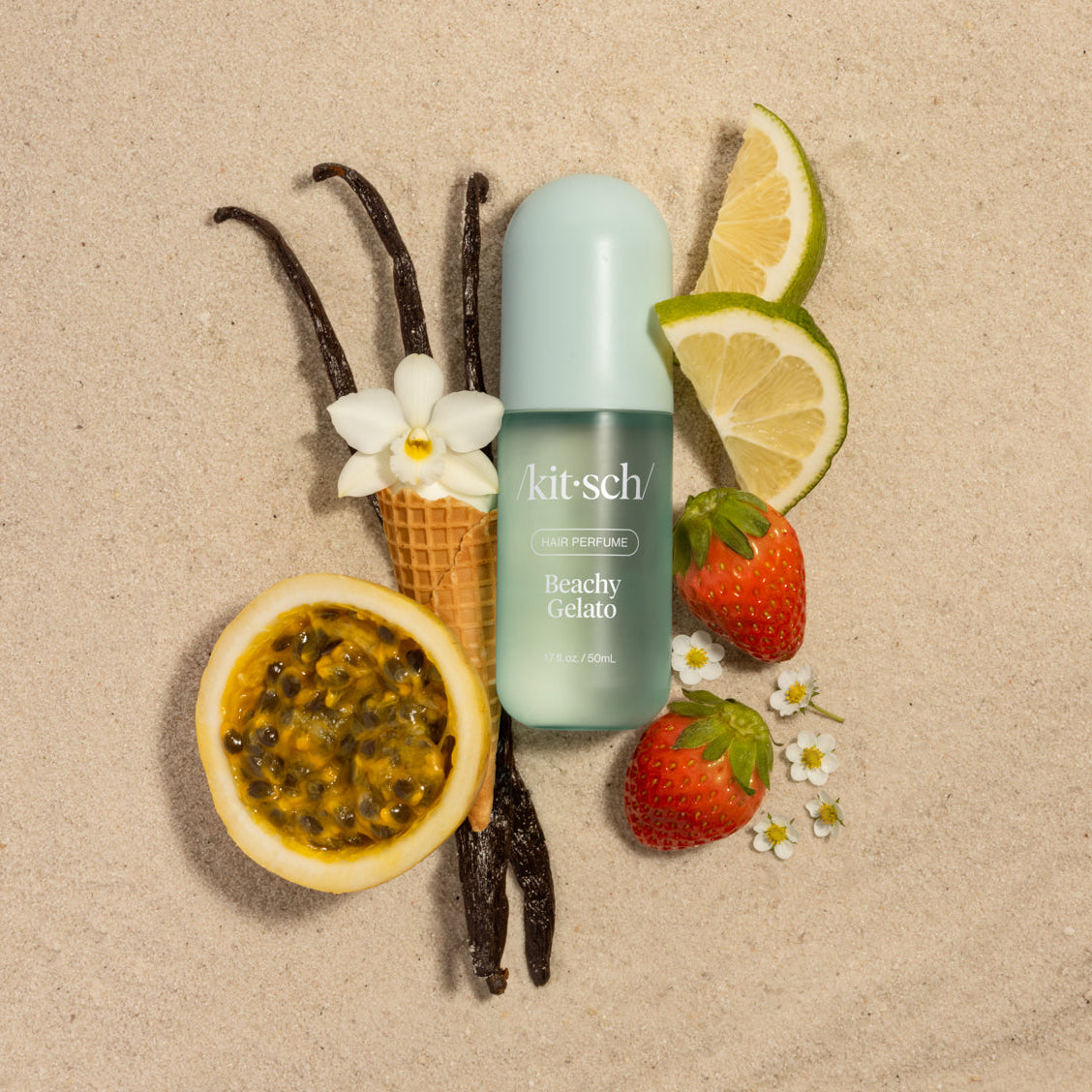 Kitsch Beachy Gelato Hair Perfume surrounded by vanilla, passion fruit, lime, strawberry scent ingredients
