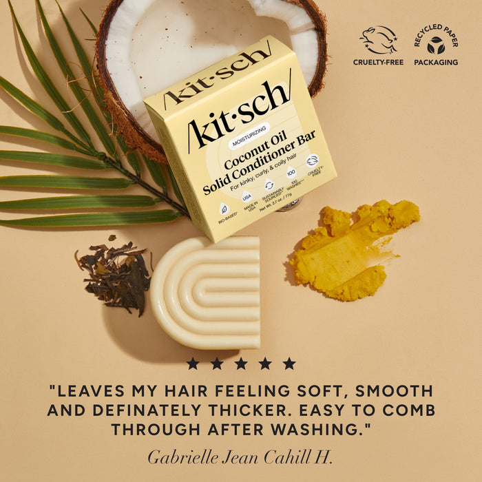Kitsch coconut oil solid conditioner bar with coconuts & leaves on a beige background. There is a Leaping Bunny Cruelty-free badge and a Recycled paper packaging badge on the top right corner. On the bottom of the image, there is a customer review that says "leaves my hair feeling soft, smooth, and definitely thicker. Easy to comb through after washing"