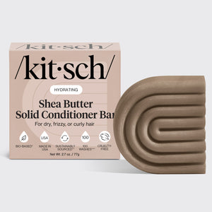 KITSCH Shea Butter Hydrating Solid Conditioner Bar — hero product shot on light gray background — HYDRATING Shea Butter Solid Conditioner Bar retail box with bar — For dry, frizzy, or curly hair — Bio-based | Made in USA | Sustainably Sourced | 100 Washes | Cruelty-Free — Net Wt. 2.7 oz / 77g — Richly hydrates dry, thirsty strands — Seals in essential moisture to help tame unwanted frizz