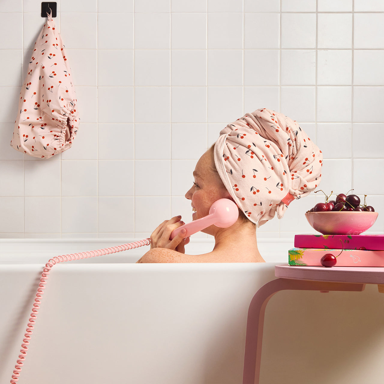 KITSCH XL Hair Towel Wrap and Satin Lined Flexi Shower Cap — Cherry Print — model wearing both pieces, post-shower routine