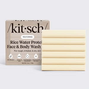 KITSCH Rice Water Protein Restoring Face & Body Wash Bar — hero product shot with /kit·sch/ packaging — cream ribbed bar 4 oz / 113g — Bio-Based, Made in USA, Sustainably Sourced, Niacinamide Infused — For rough, irritated, & dry skin