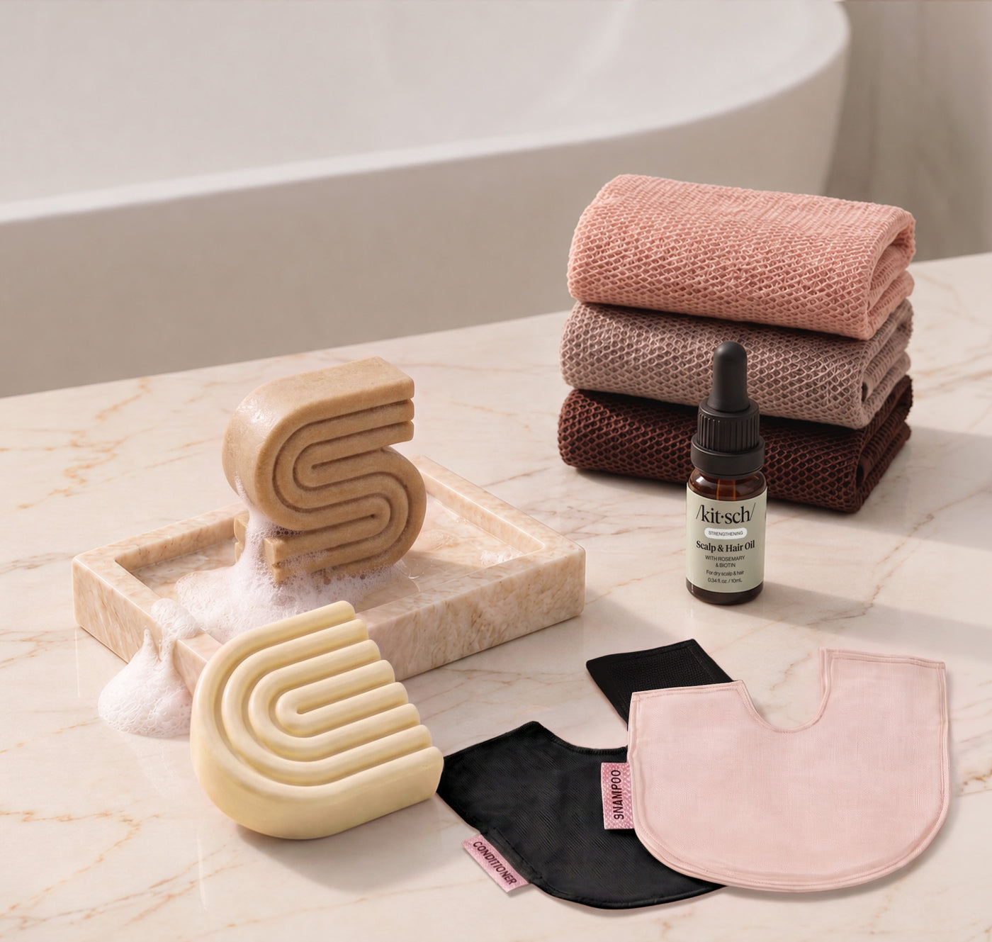 Coconut Oil: Kitsch Winter Welcome Kit with Coconut Oil shampoo and conditioner bars, Rosewood African Net Sponge, shampoo and conditioner bar bags, and Rosemary & Biotin Scalp & Hair Oil.