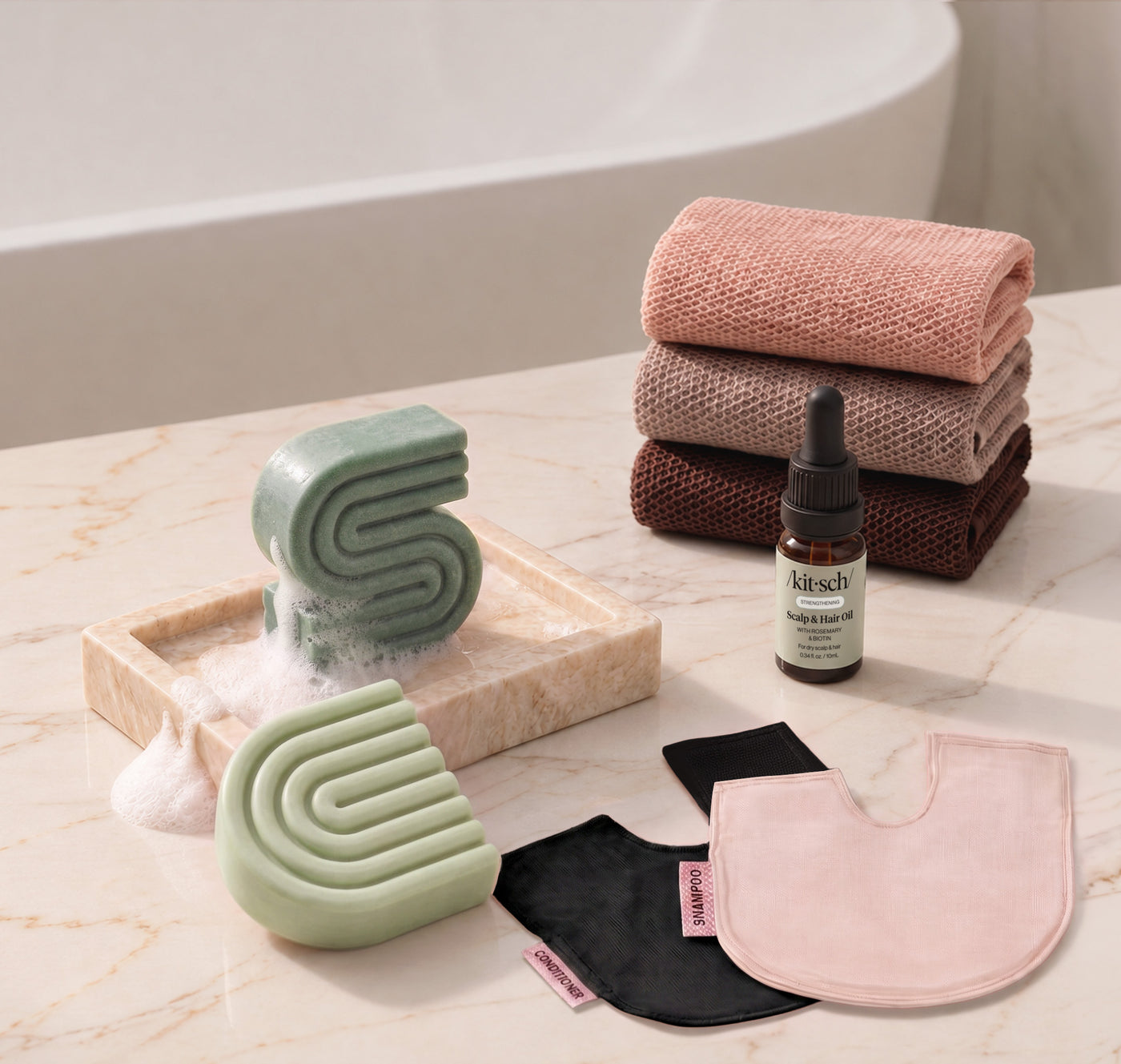 Rosemary & Biotin: Kitsch Winter Welcome Kit with Rosemary & Biotin shampoo and conditioner bars, Rosewood African Net Sponge, shampoo and conditioner bar bags, and Rosemary & Biotin Scalp & Hair Oil.